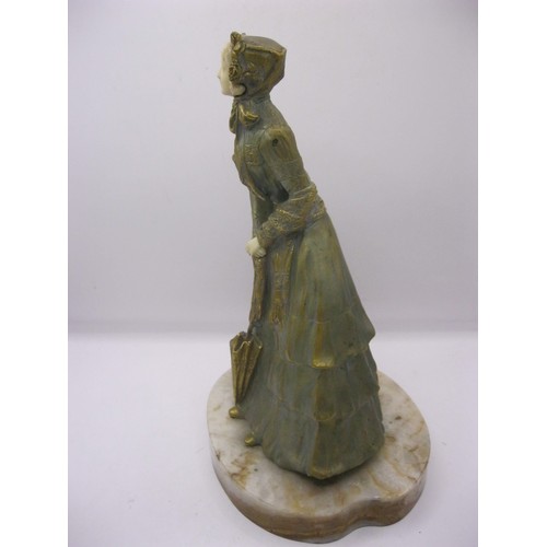 194 - A gilded bronze and carved ivory figure of a young woman on an onyx base, signed to one side Marcell... 