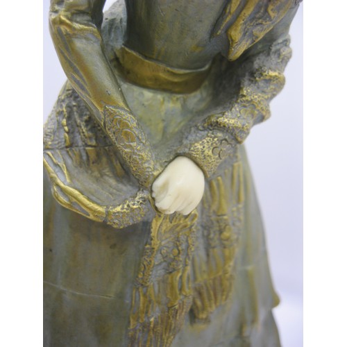 194 - A gilded bronze and carved ivory figure of a young woman on an onyx base, signed to one side Marcell... 