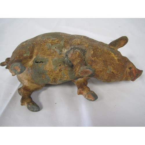 202 - An antique cold painted metal pig, originally a desk tidy or similar, with brass inserts, well worn ... 