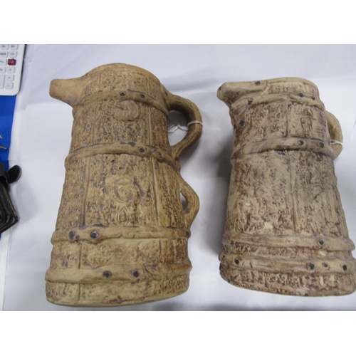 187 - 2 twin handled Hillstonia Jugs 8 inches and ten inches tall .both in perfect condition