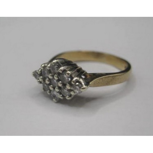 183 - A 9ct gold ring with nine chip Diamonds in a Diamond shaped setting. Total setting size 10mm by 7mm ... 