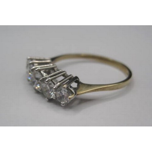 184 - A 9ct gold ring size in a good size with 5 CZ stones in a brillant cut . Raised setting size  20mm l... 