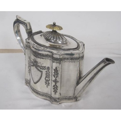 211 - A heavy silver-plated teapot with heavy engraving and a vacant cartouche .