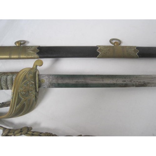 241 - An antique Royal Naval Volunteers officer's sword with scabbard and knot. Scarce Royal Naval Volunte... 