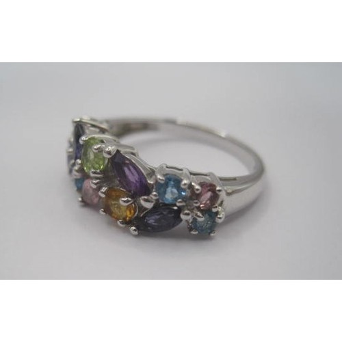 251 - A 9 carat imported white gold dress ring set with multi-colour stones. Thirteen stones of round and ... 