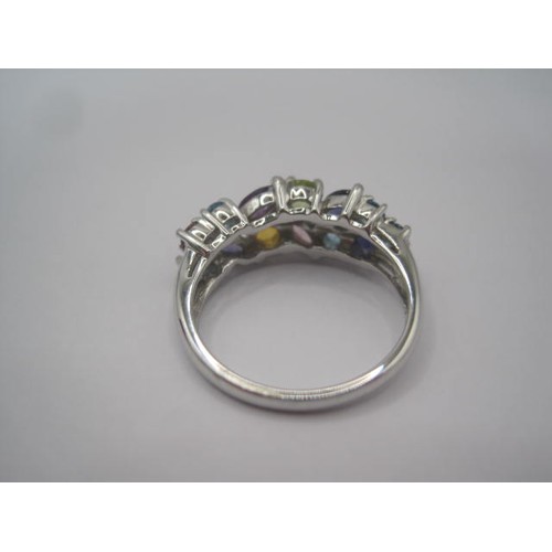 251 - A 9 carat imported white gold dress ring set with multi-colour stones. Thirteen stones of round and ... 