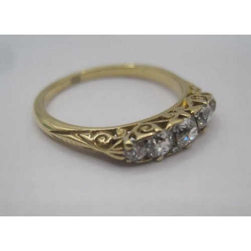 249 - An impressive 18 carat gold five-stone diamond ring. A row of five graduated round cut diamonds, the... 