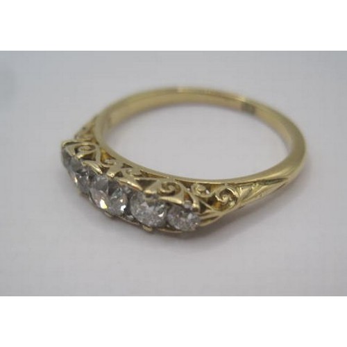 249 - An impressive 18 carat gold five-stone diamond ring. A row of five graduated round cut diamonds, the... 