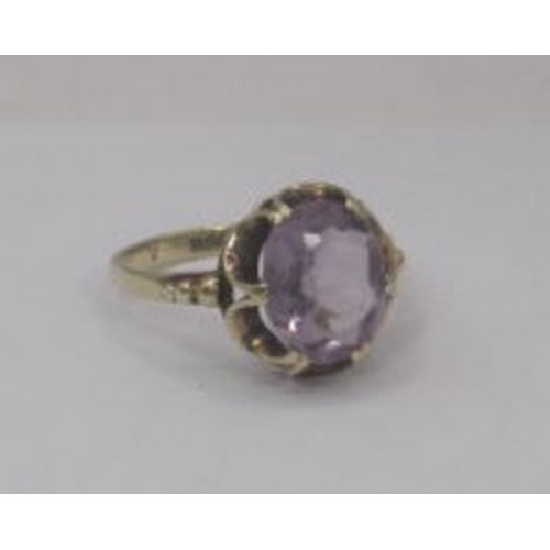 259 - A 9 carat gold amethyst ring, the oval amethyst estimated at 10.5mm x 8.5mm, in a looped claw settin... 