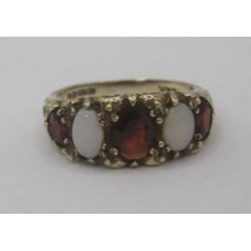 247 - A 9 carat gold opal and garnet ring, a row of three graduated garnets separated by two opals in a ra... 