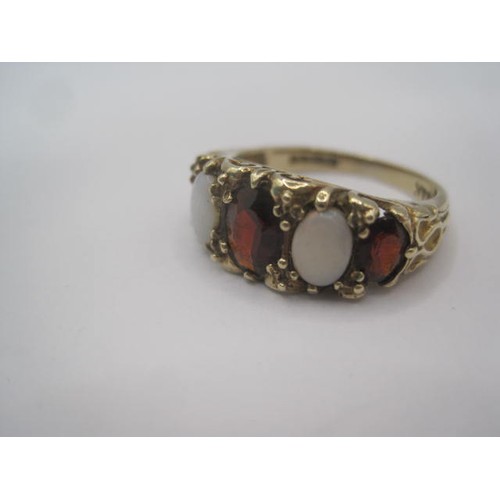 247 - A 9 carat gold opal and garnet ring, a row of three graduated garnets separated by two opals in a ra... 