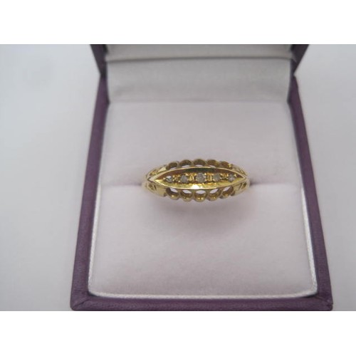 250 - An 18 carat gold ring with a large pierced oval setting, a row of five small graduated diamonds cent... 