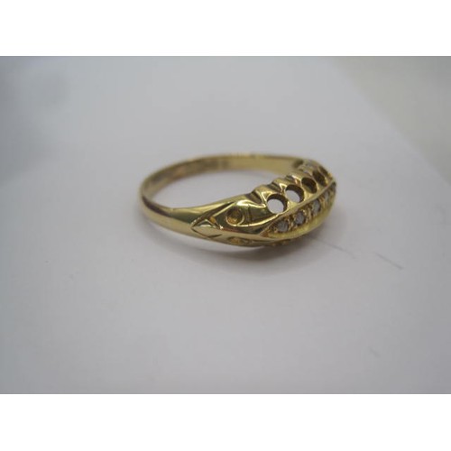 250 - An 18 carat gold ring with a large pierced oval setting, a row of five small graduated diamonds cent... 