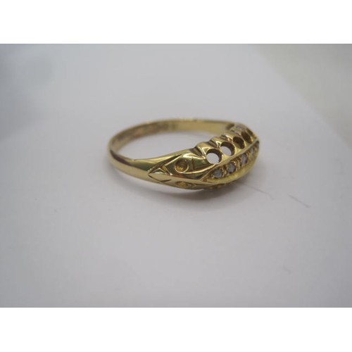 250 - An 18 carat gold ring with a large pierced oval setting, a row of five small graduated diamonds cent... 