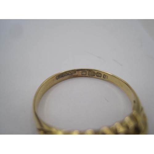 250 - An 18 carat gold ring with a large pierced oval setting, a row of five small graduated diamonds cent... 