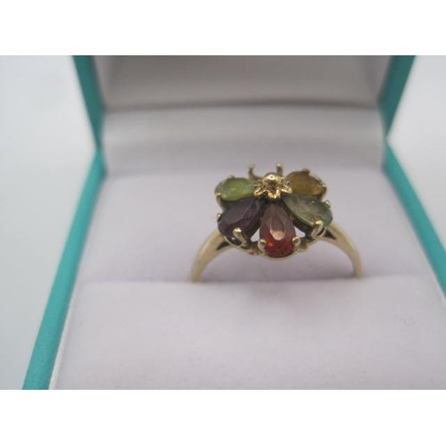 262 - A 9 carat gold multi-stone ring (a/f one stone missing). A foliate setting of five variously coloure... 