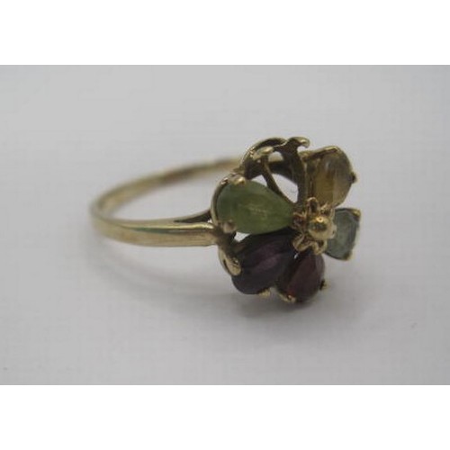 262 - A 9 carat gold multi-stone ring (a/f one stone missing). A foliate setting of five variously coloure... 