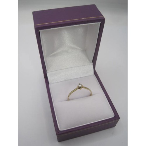 261 - A 9 carat gold dress ring set with a small white simulated solitaire stone, ring size N/O, gross wei... 