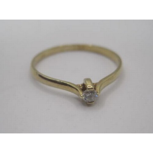 261 - A 9 carat gold dress ring set with a small white simulated solitaire stone, ring size N/O, gross wei... 