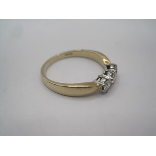 260 - A 9 carat gold ring set with a row of three diamonds in claw settings, ring size Q/R, gross weight o... 