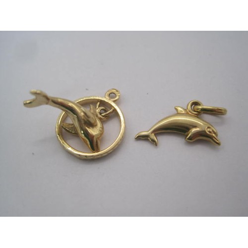 268 - Two 9 carat gold charms - a dolphin in hoop (approx. 2.3g), and a dolphin (approx. 0.3g)