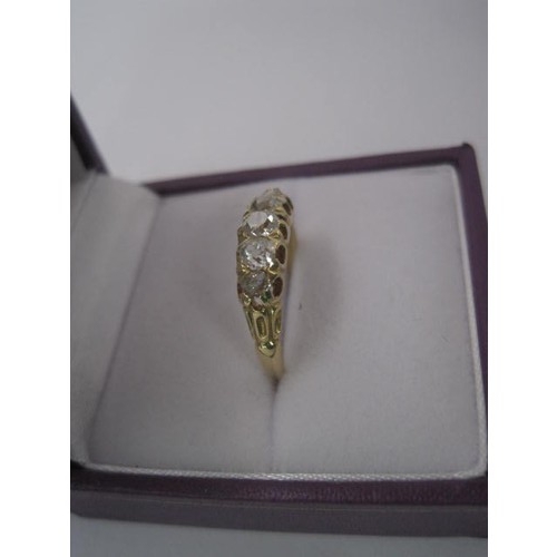 264 - An impressive gold ring set with a row of five graduated diamonds, ring size L, gross weight of ring... 