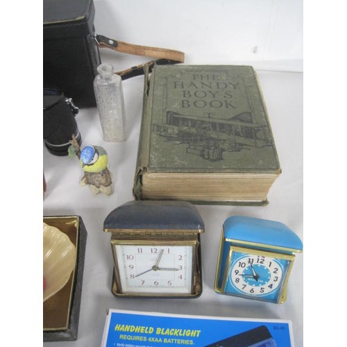 25 - A box of miscellaneous items including travel alarm clocks, pair of Swift 8 x 35 binoculars in case,... 