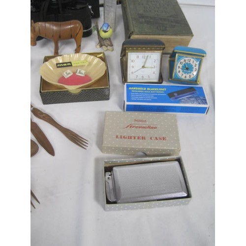 25 - A box of miscellaneous items including travel alarm clocks, pair of Swift 8 x 35 binoculars in case,... 