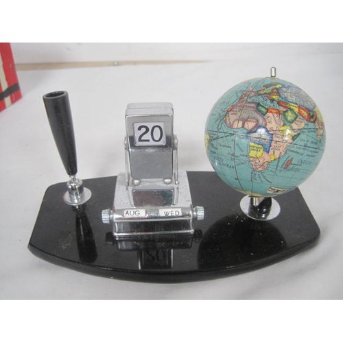 24 - A vintage pen or desk stand with perpetual calendar and globe marked Made in Japan. With original bo... 