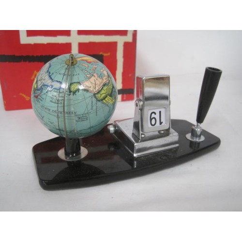 24 - A vintage pen or desk stand with perpetual calendar and globe marked Made in Japan. With original bo... 