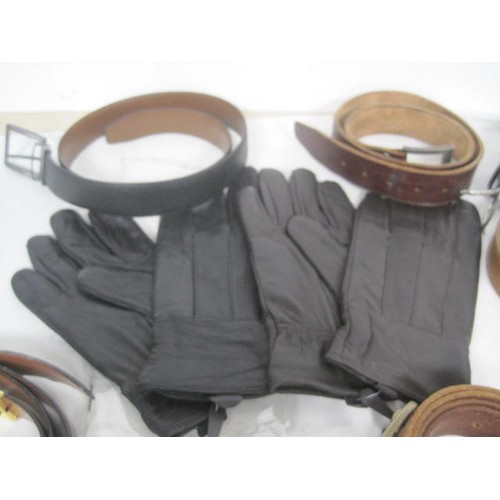 20 - An assortment of gents leather belts, wallets, key wallets and two pairs of gloves