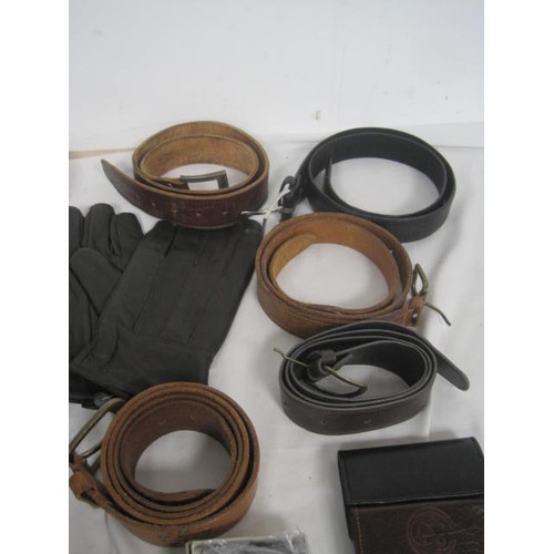 20 - An assortment of gents leather belts, wallets, key wallets and two pairs of gloves