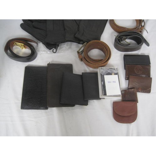 20 - An assortment of gents leather belts, wallets, key wallets and two pairs of gloves