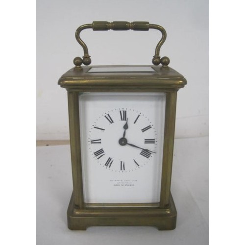 12 - A brass cased carriage clock, signed Mackay & Chisholm Edinburgh Made in France. Not seen running, a... 