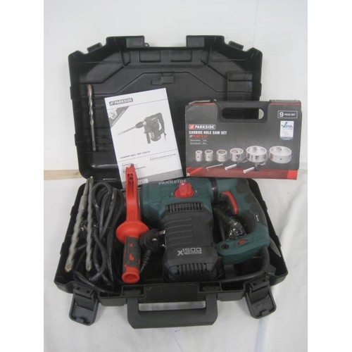 35 - Parkside cased hammer drill PBH 1500 E5, together with a Parkside cased nine-piece Carbide hole saw ... 