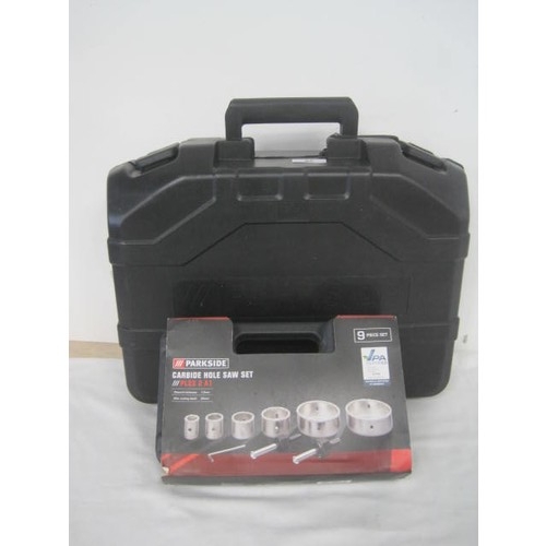 35 - Parkside cased hammer drill PBH 1500 E5, together with a Parkside cased nine-piece Carbide hole saw ... 