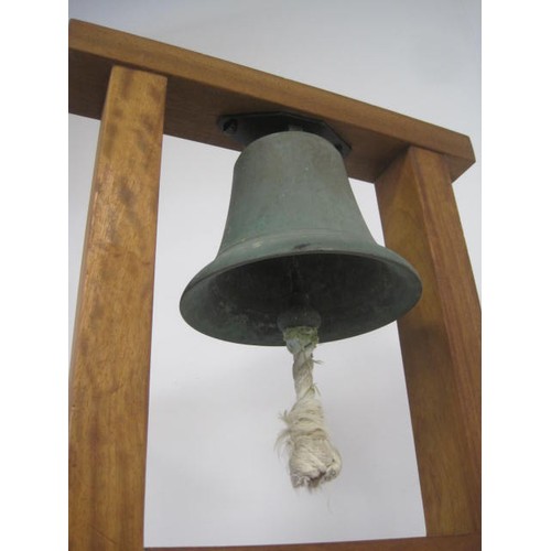 275 - RAF Scramble Bell. A bronze bell mounted on an iroko hardwood stand. With a brass plaque attached wh... 