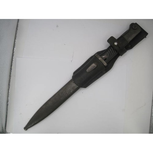 287 - A 1940 Third Reich Mauser bayonet by BERG & Co. in its steel scabbard with leather frog. Having matc... 