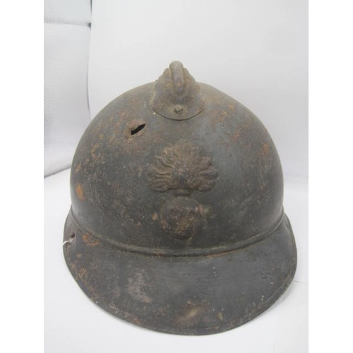 282 - A WW1 period Verdun battlefield find French Adrian helmet with RF grenade badge. No liner or identif... 