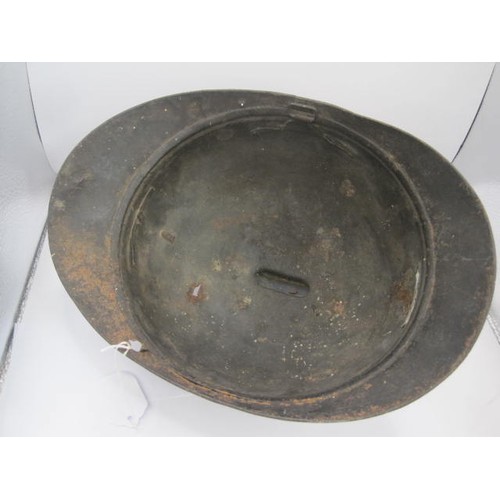 282 - A WW1 period Verdun battlefield find French Adrian helmet with RF grenade badge. No liner or identif... 