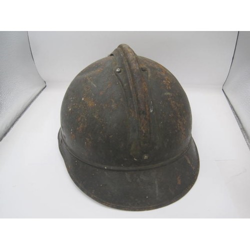 282 - A WW1 period Verdun battlefield find French Adrian helmet with RF grenade badge. No liner or identif... 