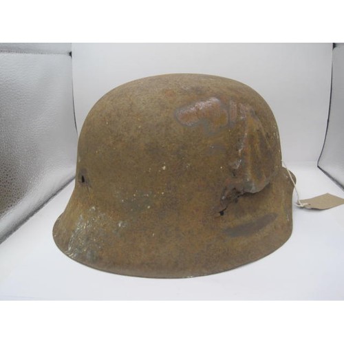 286 - A WW2 Third Reich M42 German helmet found at Carentan, France. Having a period repair on one side, v... 