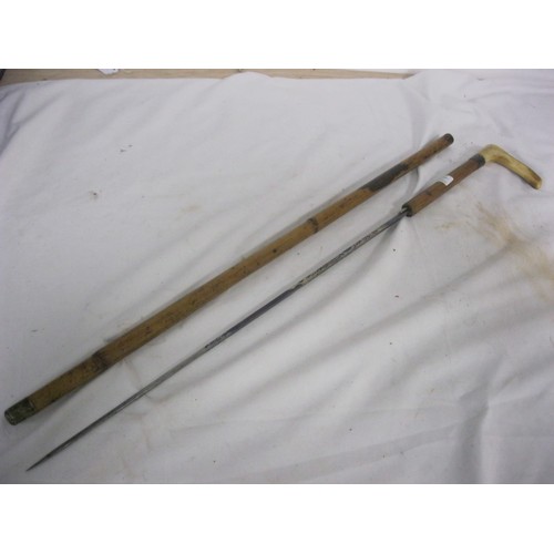 303 - 444 A cane shafted sword stick with a 50.5cms diamond section blue & gilt blade and stag horn handle... 