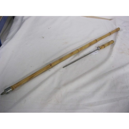 306 - 448 A bamboo shafted sword stick with a 24cms square blade, with an overall length of 92.5cms.