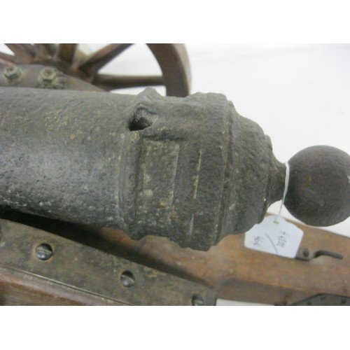 315 - 463 A 19th century Signal Cannon. Having a cast iron barrel 45cms long overall with an approximate b... 