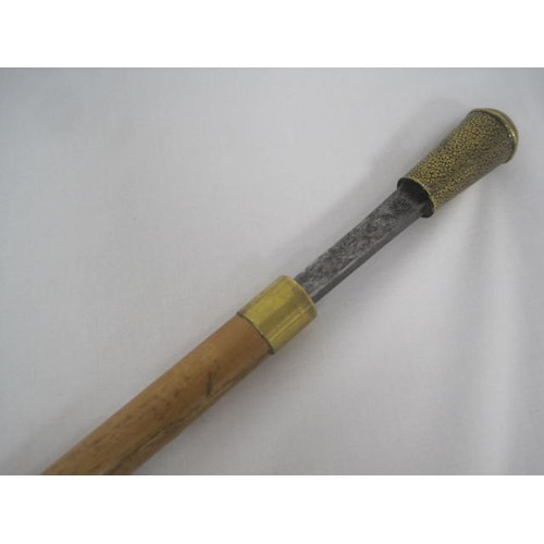 304 - 446 A bamboo shafted sword stick with a 76.5cms rectangular section blade, with an overall length of... 