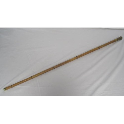 304 - 446 A bamboo shafted sword stick with a 76.5cms rectangular section blade, with an overall length of... 