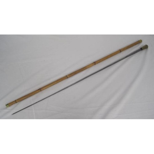 304 - 446 A bamboo shafted sword stick with a 76.5cms rectangular section blade, with an overall length of... 