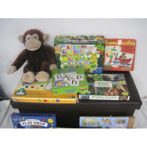 39 - A selection of boxed children's games and books, including fuzzy-felt, giant animal alphabet, crayon... 