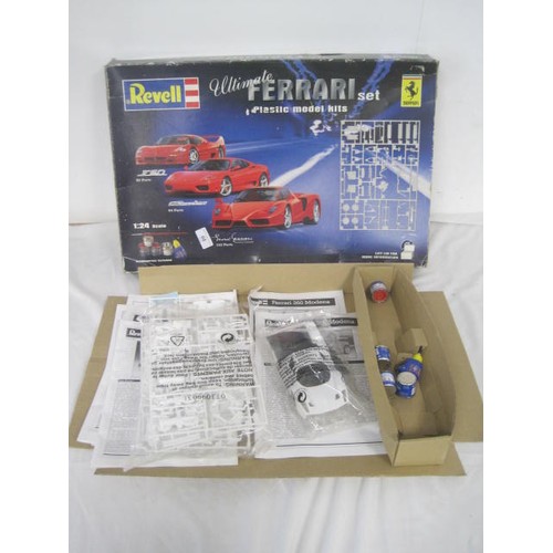 68 - A Revell Plastic model kit of a Ferrari .looks to be one car with paints ,Glue  etc but stored in a ... 